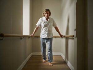 Gentle Exercise at Home: Simple Routine After 40 2 Gentle exercise at home demonstrated with a heel-to-toe walk for balance and mobility.